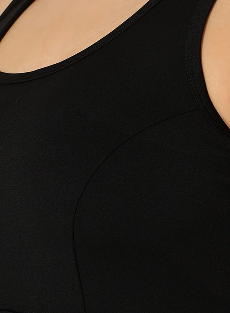 Clovia Black Medium Impact Padded Racerback Sports Bra in Black for Women | Best Price UAE